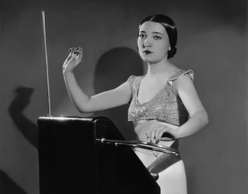 A woman playing a theremin.