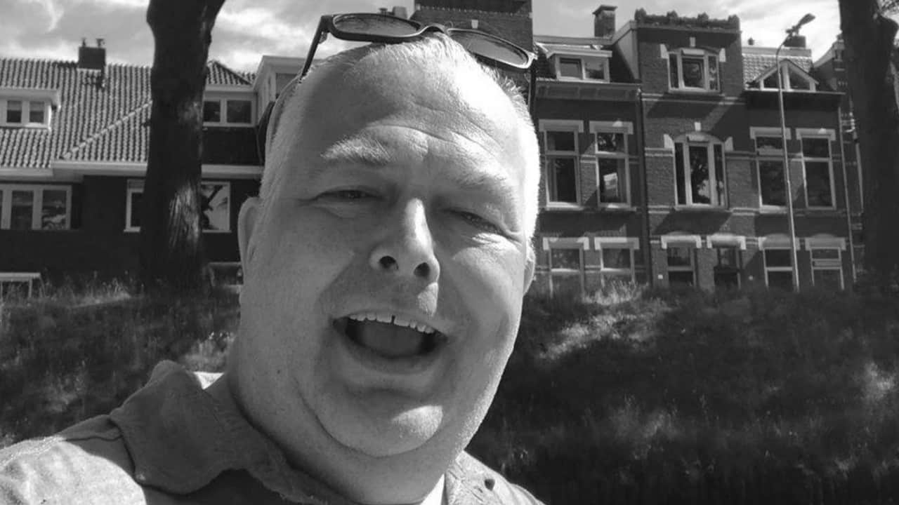 Black-and-white photo of Black Hole Agency and Twenty4Seven Management booking agent Dimitri De Wit smiling.