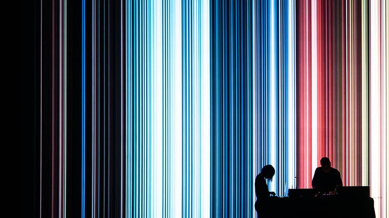 A photo of a performance by Drew McDowall and Florence To at MUTEK Montréal taken by Bruno Destombes.