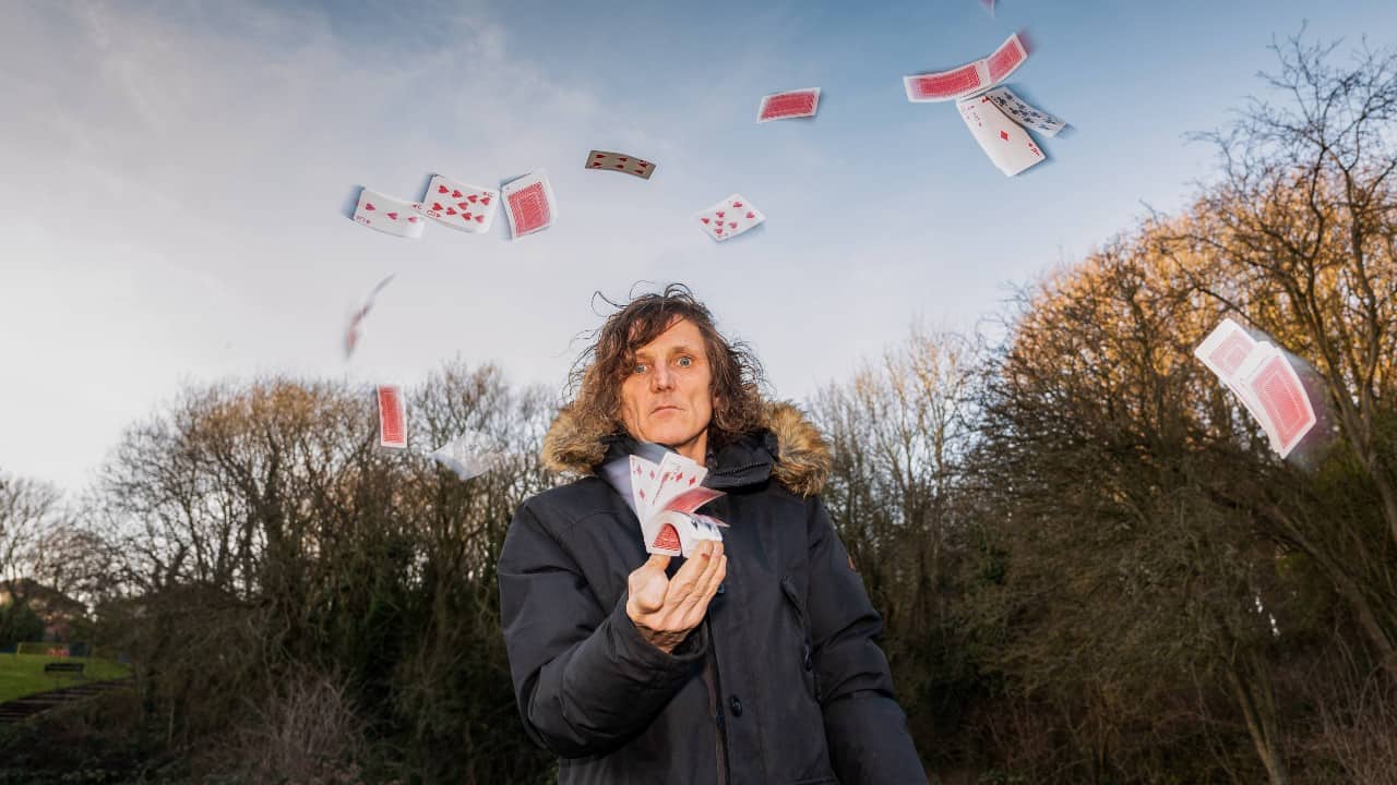 Pete Birch of Digs & Woosh and DiY Soundsystem shooting cards into the air outside.