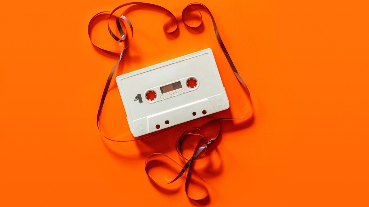 Cassette tape orange background David Schludi